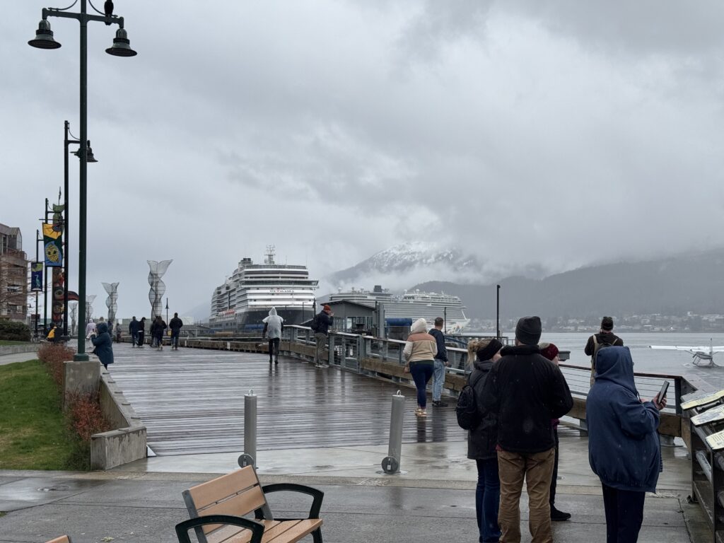 The waterfront boardwalk in Juneau with cruise ships in the background